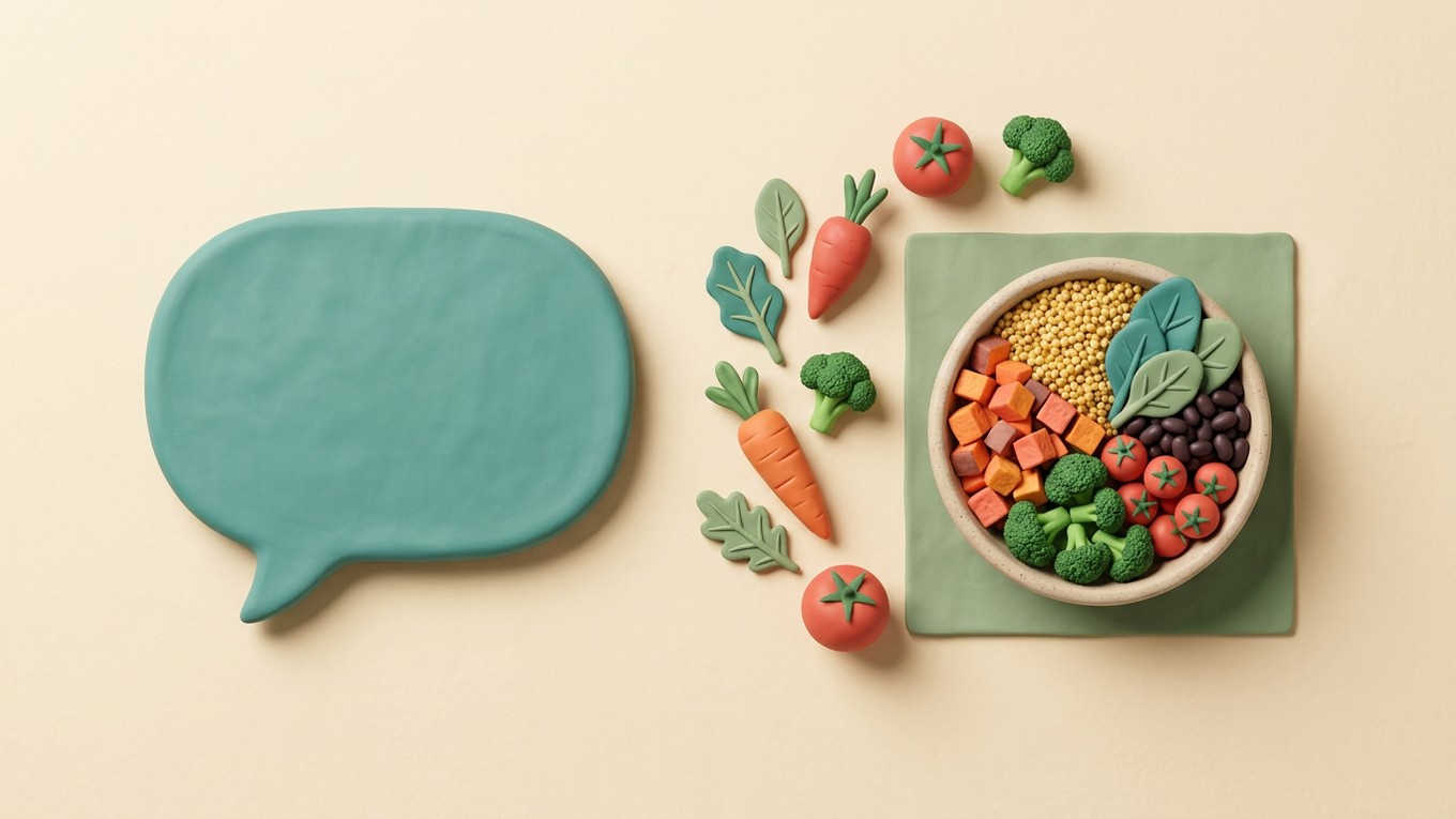 Clay-style illustration of a teal speech bubble beside a bowl of colorful vegetables and beans on a cream background